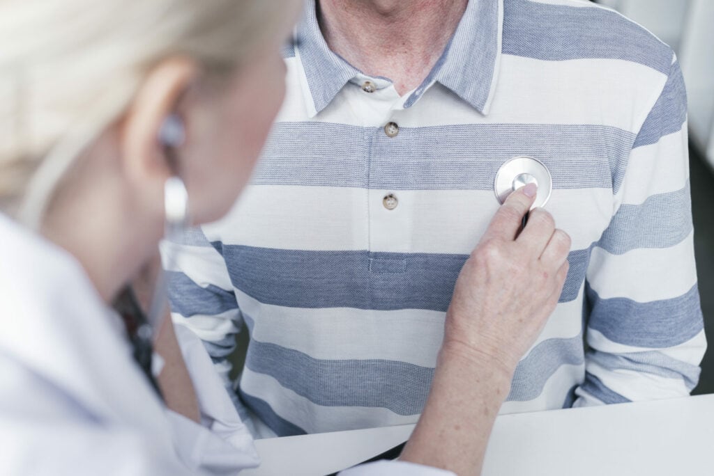 doctor tending patient scaled 1