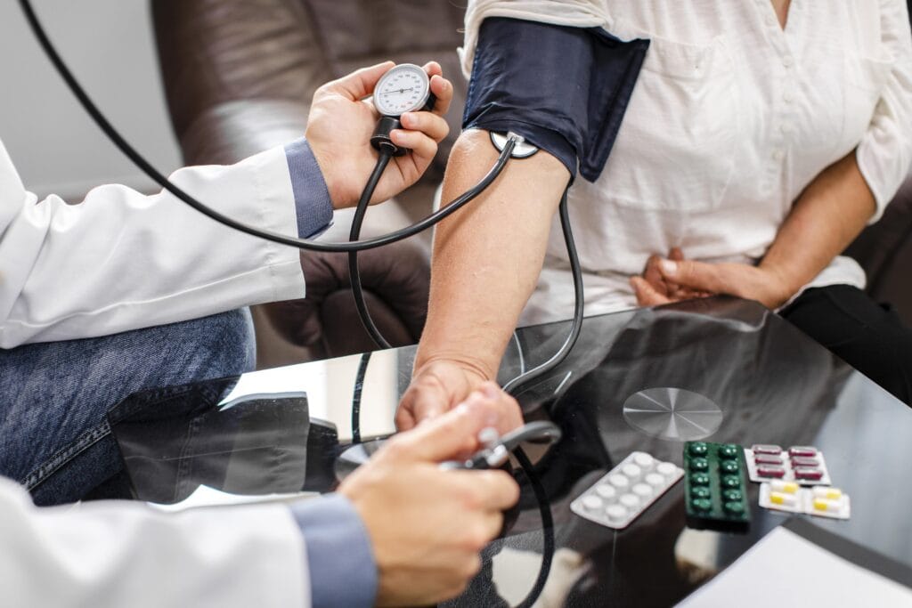 male doctor hands measuring tension patient min
